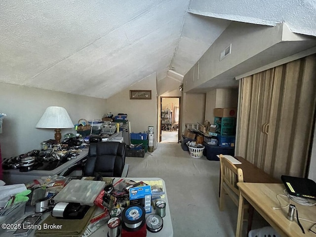 bonus room with lofted ceiling and a textured ceiling