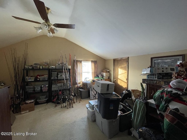 interior space featuring ceiling fan, light carpet, and vaulted ceiling