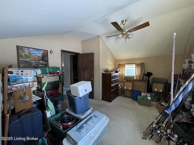 interior space featuring ceiling fan, lofted ceiling, and light carpet