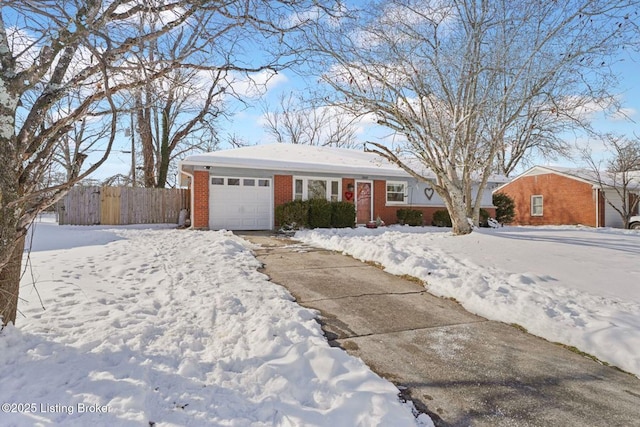 single story home featuring a garage