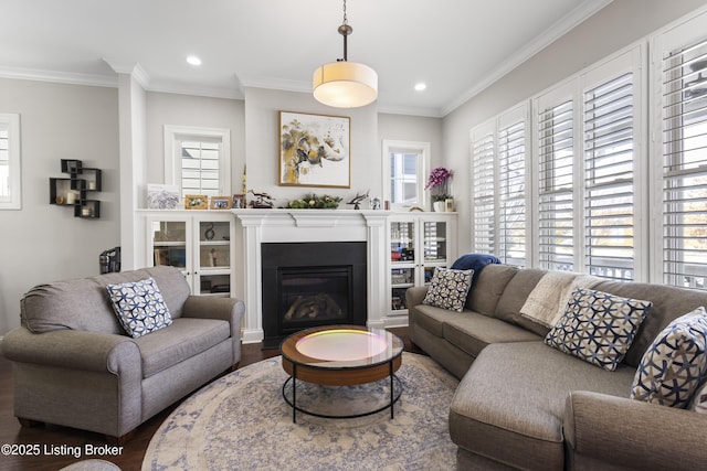 living room with hardwood / wood-style flooring and crown molding