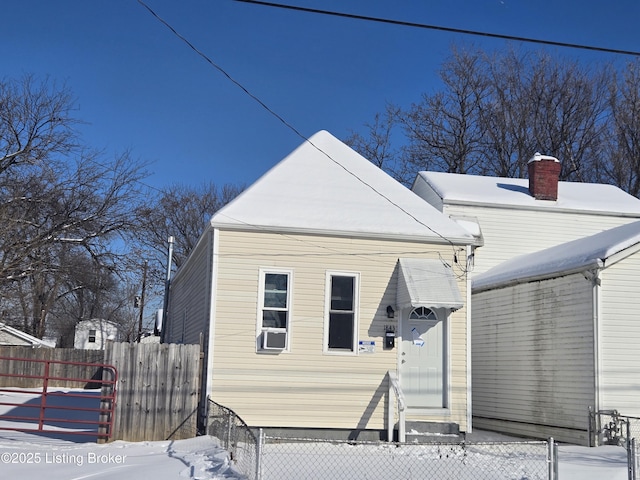 snow covered property featuring cooling unit