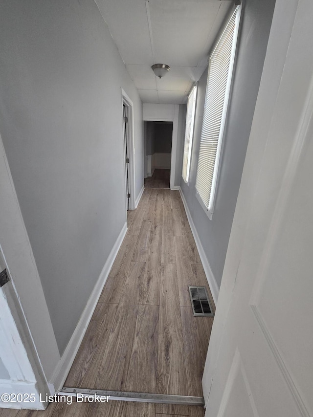 corridor featuring light hardwood / wood-style flooring