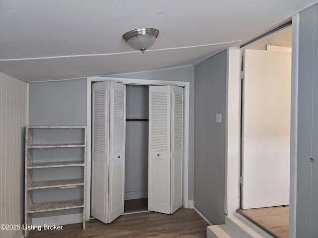 unfurnished bedroom with hardwood / wood-style floors and a closet