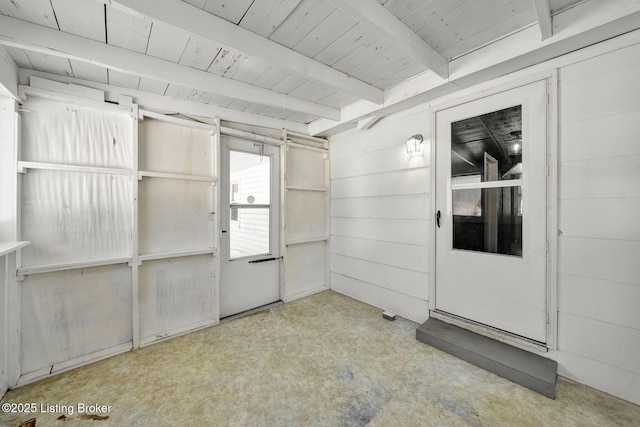 interior space featuring wood ceiling and beamed ceiling