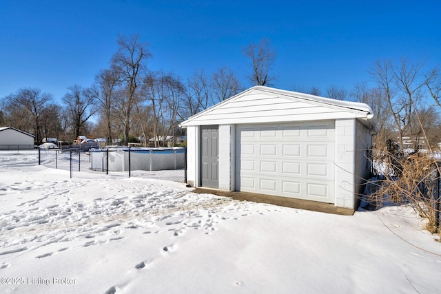 view of snow covered garage