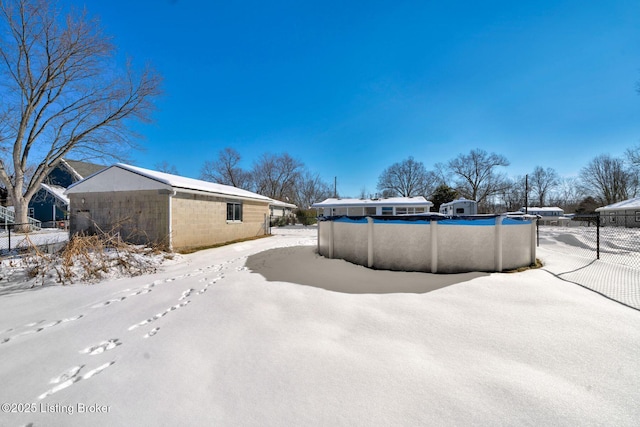 exterior space with a covered pool