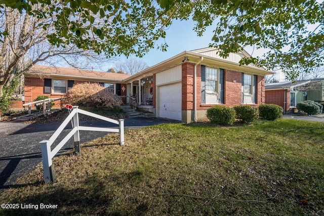 view of front of house with a garage and a front yard