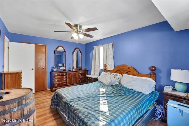 bedroom featuring ceiling fan and light hardwood / wood-style floors