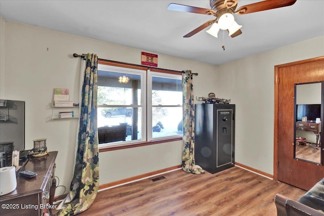 interior space with hardwood / wood-style flooring and ceiling fan