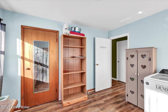 office space featuring dark hardwood / wood-style flooring and washer / dryer