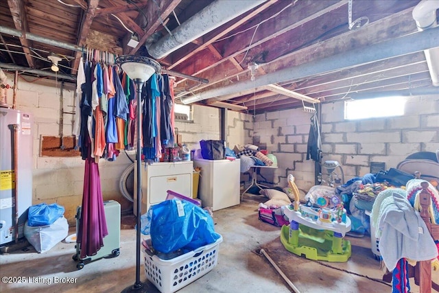 basement with washer and dryer and water heater