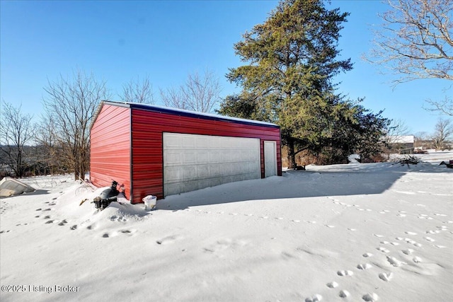 view of snow covered garage