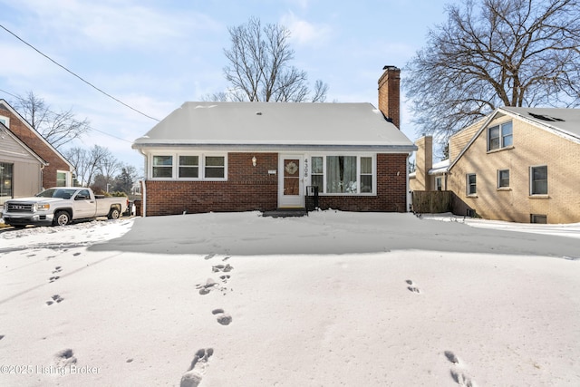 view of snow covered house