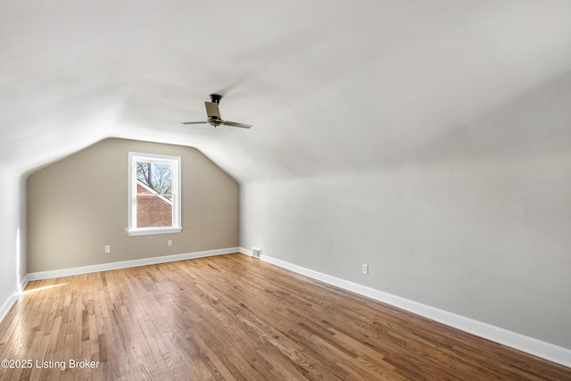 additional living space featuring lofted ceiling, ceiling fan, and light hardwood / wood-style flooring