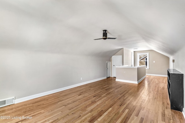 bonus room with ceiling fan, light hardwood / wood-style floors, and lofted ceiling