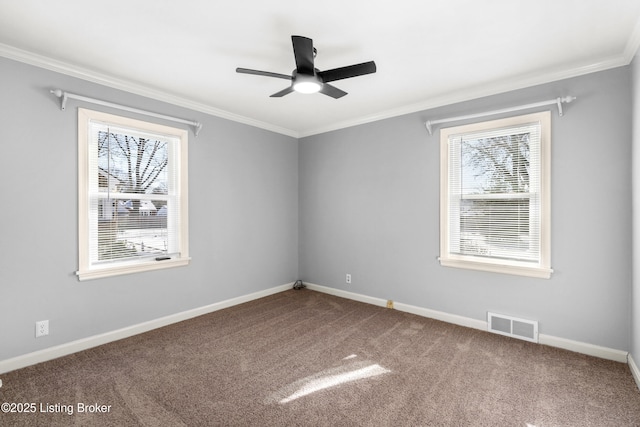 carpeted empty room with ceiling fan and crown molding