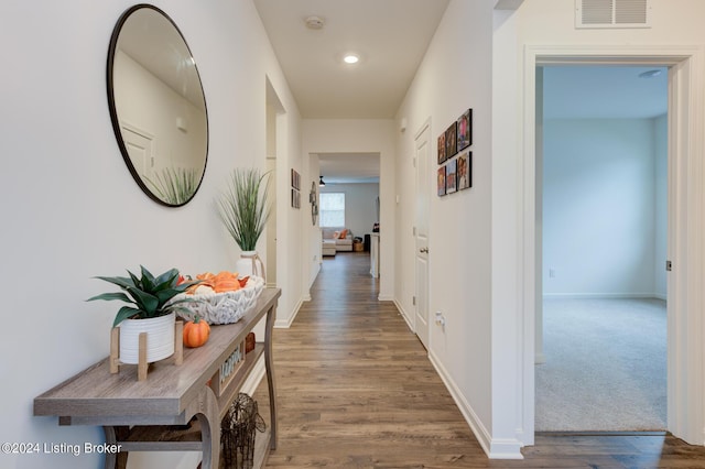 corridor with dark wood-type flooring