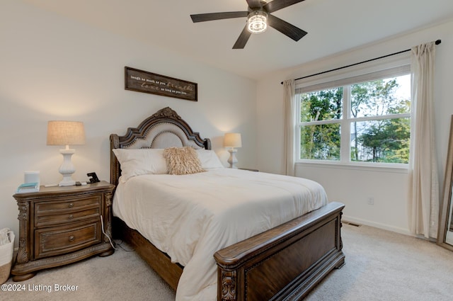 carpeted bedroom with ceiling fan