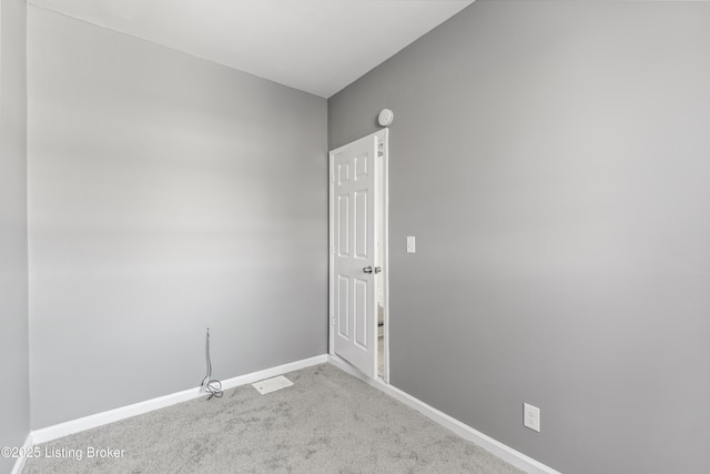 spare room with light colored carpet