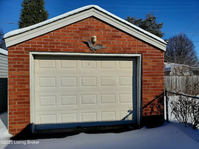 view of snow covered garage