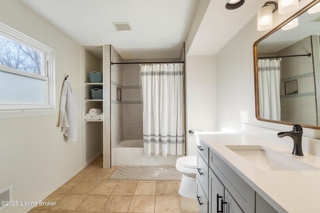 bathroom featuring tile patterned flooring, visible vents, toilet, shower / bath combo with shower curtain, and vanity