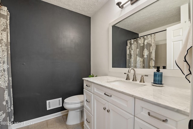 bathroom with vanity, visible vents, a textured ceiling, tile patterned floors, and toilet