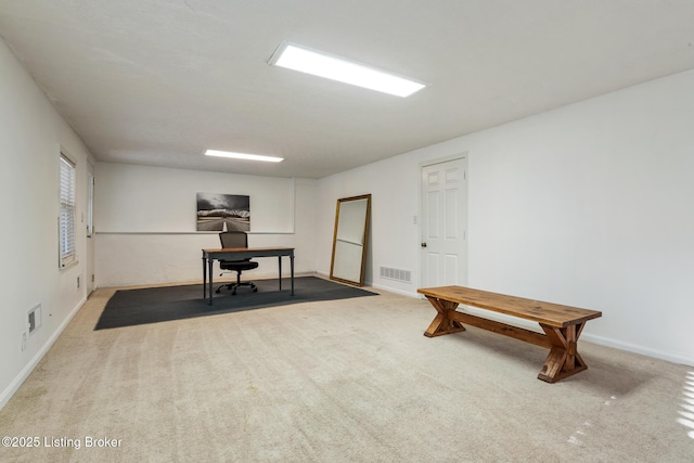 home office with carpet, visible vents, and baseboards