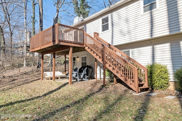 exterior space featuring stairway, a deck, and a patio area