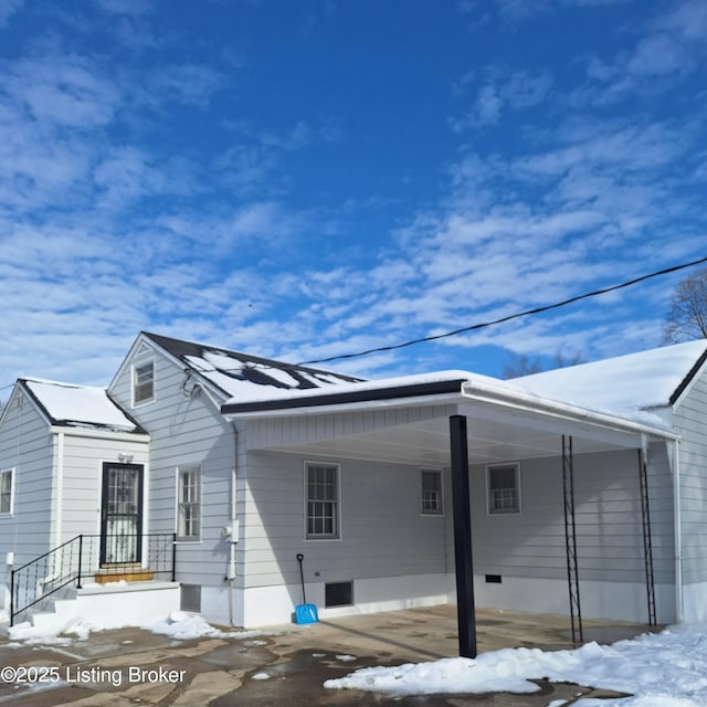 exterior space with a carport