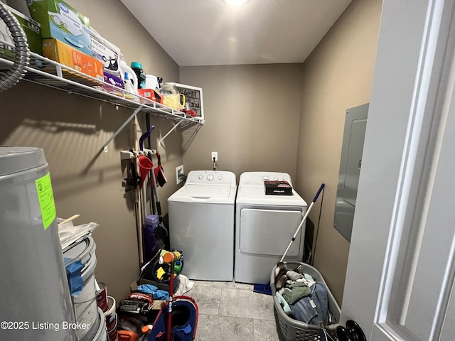 clothes washing area with separate washer and dryer