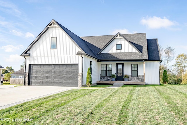 modern inspired farmhouse featuring covered porch and a front yard