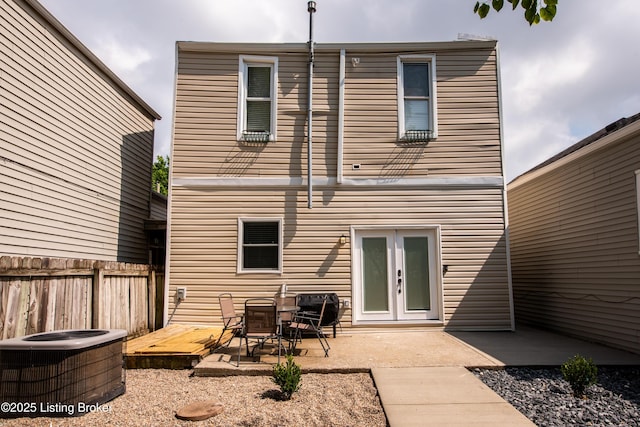 back of house featuring french doors, a patio, and central air condition unit