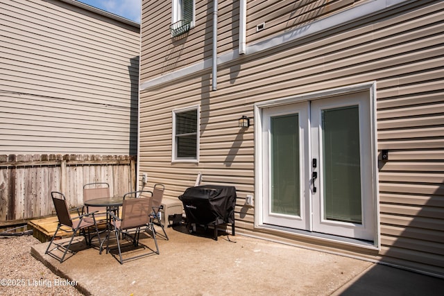 view of patio with area for grilling and french doors