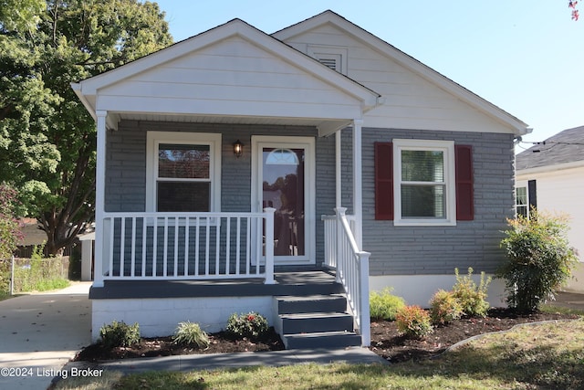 bungalow-style home with a porch