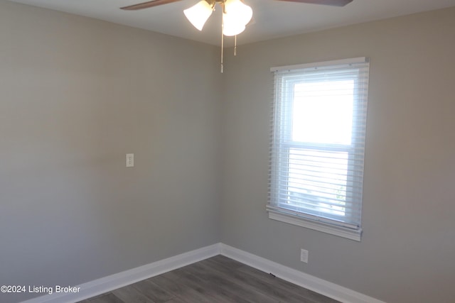 unfurnished room with ceiling fan and dark hardwood / wood-style floors