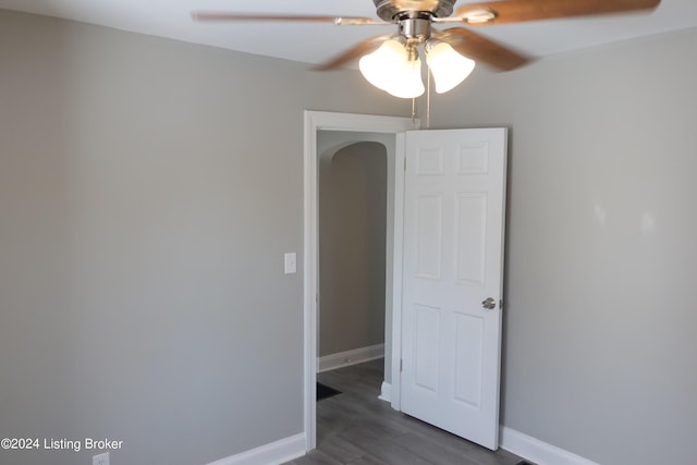 empty room featuring ceiling fan and hardwood / wood-style floors