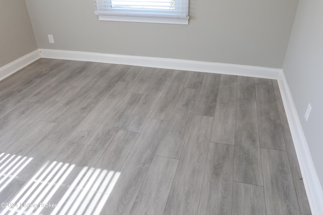 unfurnished room featuring light hardwood / wood-style floors