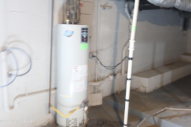 utility room with gas water heater