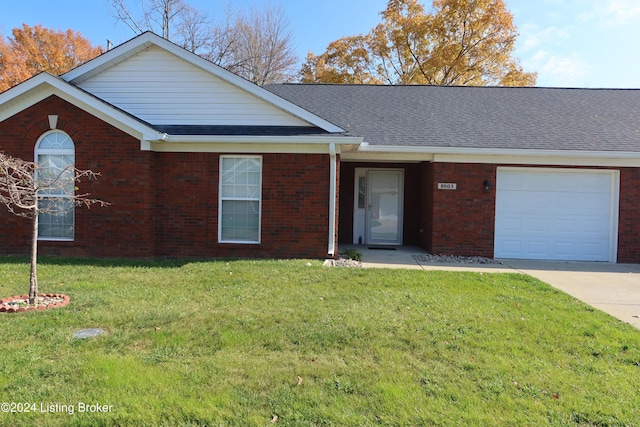 single story home featuring a front yard and a garage