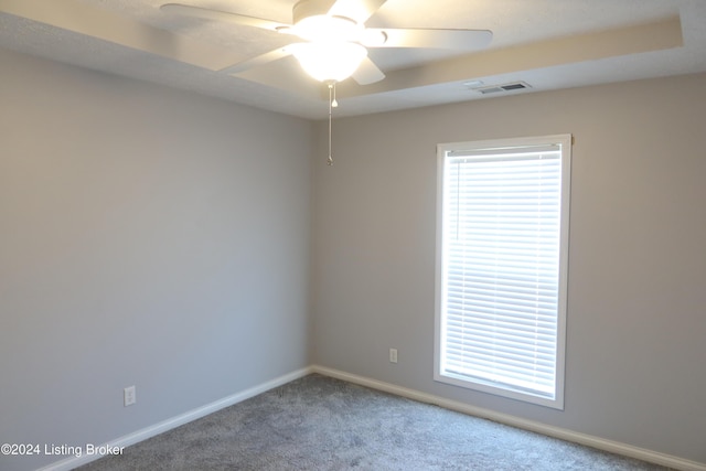 empty room with carpet flooring and ceiling fan