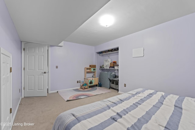 bedroom featuring light carpet and a closet