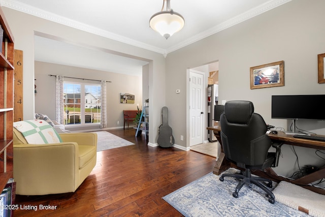 home office with dark hardwood / wood-style flooring and ornamental molding