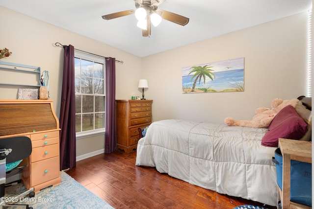 bedroom with dark wood-type flooring and ceiling fan