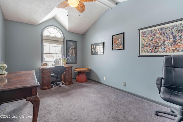 office area with carpet, lofted ceiling with beams, ceiling fan, and a textured ceiling