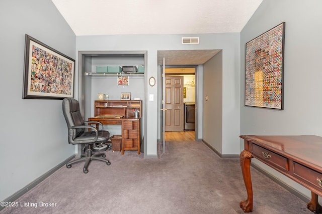 office space featuring carpet flooring and lofted ceiling