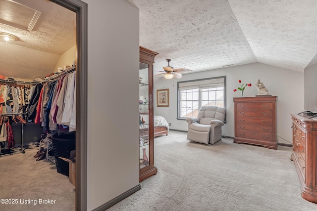 bedroom featuring lofted ceiling, a closet, and a textured ceiling