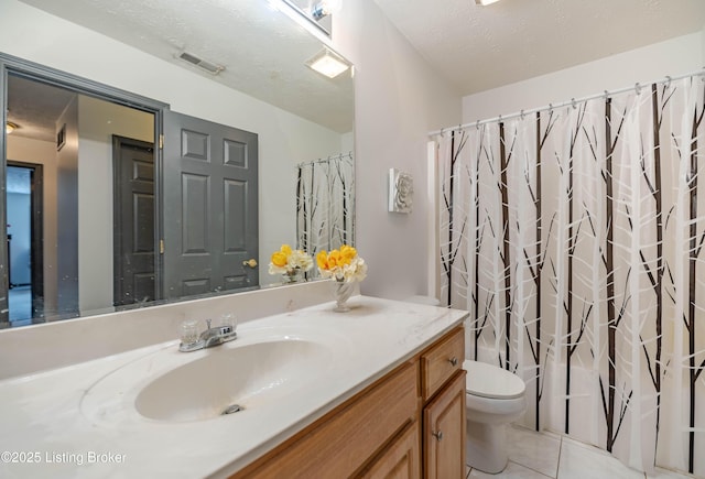 full bathroom with vanity, tile patterned floors, toilet, a textured ceiling, and shower / tub combo with curtain