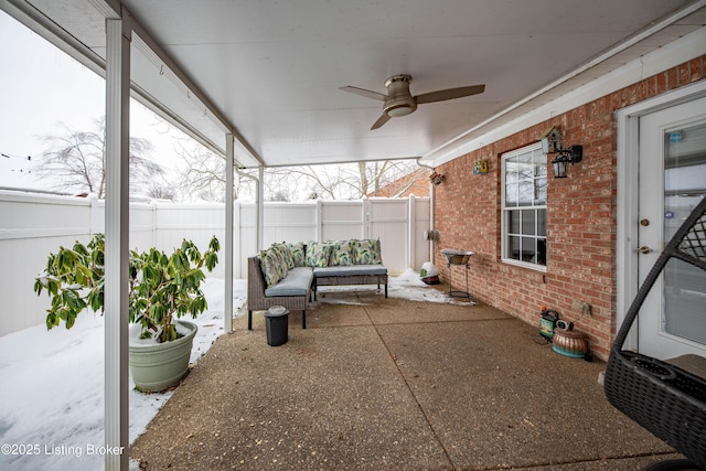 sunroom featuring ceiling fan