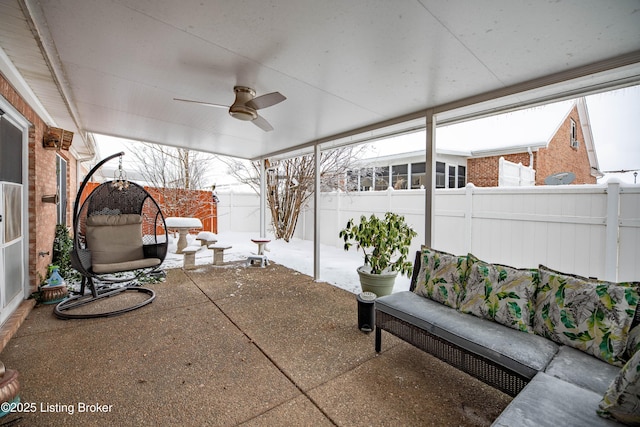 sunroom / solarium with ceiling fan